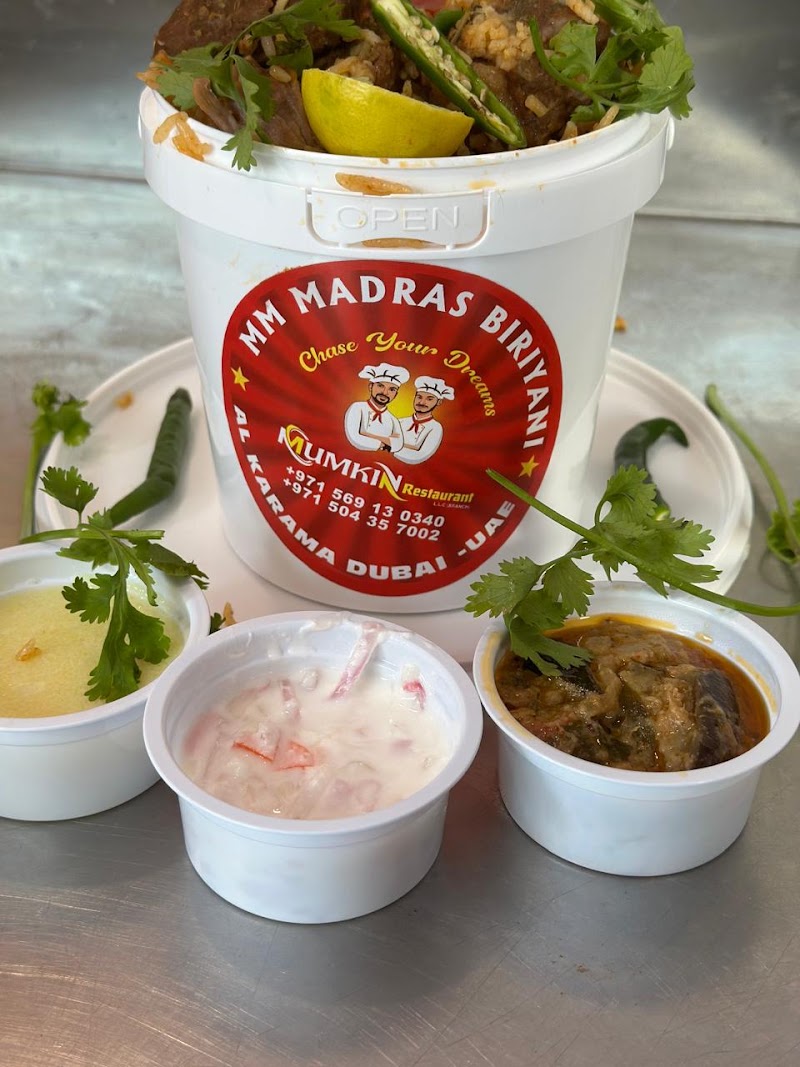 MM Madras bucket biriyani with sides, in a Mumkin-branded bucket