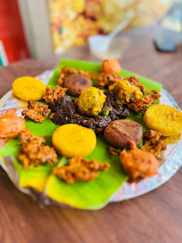 Kerala tea-time snacks arranged on a banana leaf